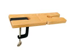 a woodworking bench with two vices on it's sides and a black handle