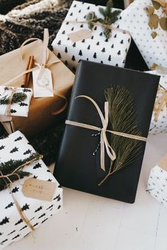 presents wrapped in black paper and tied with twine