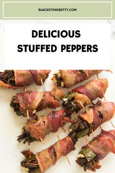 bacon wrapped stuffed peppers on skewers with text overlay that reads delicious stuffed peppers