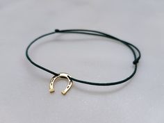 Hand made minimal bracelet. 925 sterling silver or 14k solid gold (material depends on you) Horseshoe shaped pendant on durable silk cord with sliding knot clasp. It's comfortable and adjustable. The bracelet size fits all wrists, but please message me if you need individual lenght, I'm happy to make it for you! Cord color of your choice, depending on stock availablility, search the selection picture. Adjustable Gold Horseshoe Jewelry, Silk Cord Jewelry, Sliding Knot Bracelet, Sparkly Bracelets, Minimal Bracelet, Pendant Minimalist, Horseshoe Pendant, Rose Gold Beads, Lucky Bracelet