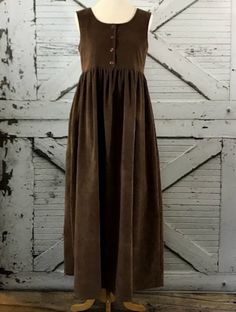 Casual Brown A-line Sleeveless Dress, Casual Brown Sleeveless Maxi Dress, Brown A-line Sundress Midi Dress, Brown Sleeveless Midi Dress For Fall, Brown Sleeveless Dress With Buttons, Sleeveless Buttoned Maxi Dress For Daywear, Sleeveless Maxi Dress With Buttons For Daywear, Sleeveless Brown Maxi Dress For Fall, Sleeveless Brown Midi Dress For Daywear