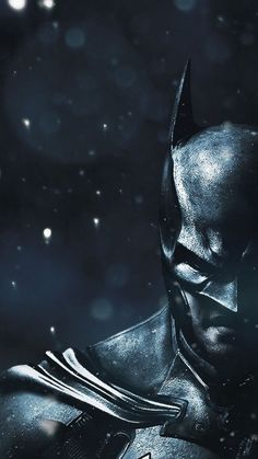 the dark knight in batman ark is looking down at his chest and head, while he stands