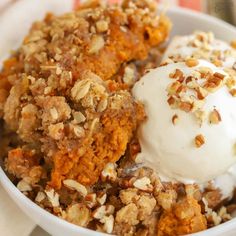 a close up of a bowl of food with ice cream and toppings on top