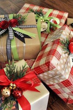 three wrapped presents sitting on top of a wooden floor