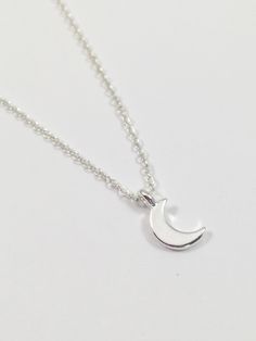 This dainty necklace features a single crescent silver plated moon charm. The chain(soldered 2mm x 1.5mm) and findings(4mm jump rings) are all silver plated.  The necklace is available in various lengths. Check out more items from my shop here: https://www.etsy.com/shop/ElizaJaneKJewelry Cheap Small Silver Jewelry, Cheap Dainty Metal Charm Necklaces, Cheap Silver Moon Shaped Necklace, Cheap Silver Moon-shaped Necklace, Cheap Customized Metal Necklace, Cheap Moon Charm Necklace, Affordable Silver Moon-shaped Jewelry, Cheap Customized Metal Necklaces, Cheap Crescent Moon Charm Jewelry