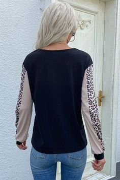 Pattern: Leopard/color block Features: Long sleeves, ribbed cuff Neckline: Round neck Stretch: Slightly stretchy Product measurements: S: bust 37 in, length 24 in, sleeve 22 in, shoulder 18 inM: bust 39 in, length 24 in, sleeve 22 in, shoulder 19 inL: bust 41 in, length 25 in, sleeve 23 in, shoulder 19 inXL: bust 44 in, length 25 in, sleeve 23 in, shoulder 20 in Material composition: 65% polyester, 35% cotton Care: Machine wash cold. Tumble dry low. Imported