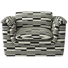 a black and white checkered chair with two pillows on the arm, sitting against a white background