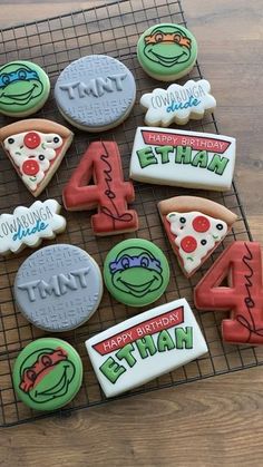 decorated cookies on a cooling rack with the numbers four, four, six and seven