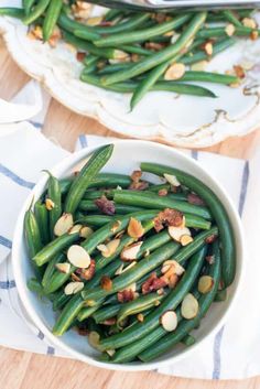 green beans with almonds in a white bowl