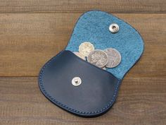 a wallet with some coins sticking out of it