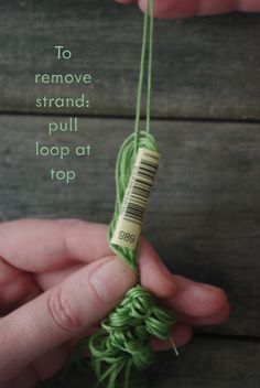 someone is knitting something green with the words to remove strands pull loop at top