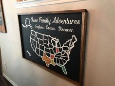 a sign on the wall that says those family adventures explore dream discovery and also has a map of the united states