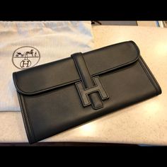 New Unused Jige Clutch. With Dust Bag Luxury Black Clutch With Palladium Hardware, Timeless Black Travel Clutch, Designer Travel Clutch With Magnetic Closure, Hermes Jige Clutch, Hermes Jige, Hermes Bags, Beaded Bags, Continental Wallet, Limited Time