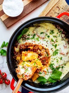 a pan filled with lasagna sauce and cheese