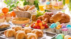 a table filled with lots of different types of food and drinks on it's sides