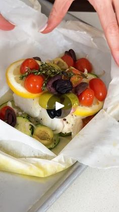 2.4M views · 957 reactions | Mediterranean Cod en Papillote | En papillote, dinner, Mediterranean cuisine | This Mediterranean cod en papillote is the most genius way to quickly achieve a simple, healthy, and super delicious dinner! Recipe:... | By Downshiftology | You guys are going to love this
Mediterranean cod ampapio. Pieces of cod are placed on a
bit of zucchini then topped with sliced lemon, shallot,
grape tomatoes, and olives. A little sprig of fresh thyme and
a drizzle of extra virgin olive oil finishes them off. You'll
seal the parchment paper packets by crimping the edges
and then let the fish steam in the oven for a very quick 15
minutes. Now, trust me, I'm not lying when I say this is one of
these simplest recipes on my website that delivers up a wow
worthy cod dinner. The fis Mediterranean Entrees, Cod Dinner, Steamed Cod, Mediterranean Cod, Sliced Lemon, Mediterranean Fish Recipe, Recipes Mediterranean, Low Calorie Breakfast, Mediterranean Diet Plan