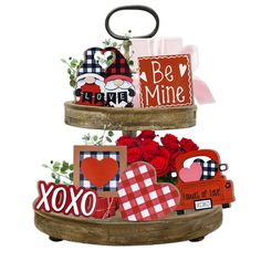 three tiered wooden tray with valentine's day cards and decorations on it,