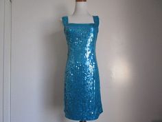 "This is a Stunning Vintage by Designer NITELINE Blue Green Teal Mermaid Sequin Square Neckline Sleeveless Evening Party Dress Size 8 S-M All measurements are approximate: Armpit to armpit 16\" length 36\" ( from shoulder to hem) This fabulous mini dress is in very good vintage condition with very little sign of wear, and ready to wear. Material: 100% Polyester, Sequins For more beautiful and fabulous of vintage Dresses Handbags and Accessories please see our \"Handbags Accessories clothing\" Sh Blue Sequined Mermaid Dress For Night Out, Fitted Sequin Sleeveless Prom Dress, Fitted Sleeveless Sequin Dress For Prom, Glamorous Sleeveless Fitted Mermaid Dress, Sleeveless Summer Mermaid Prom Dress, Fitted Sleeveless Glamorous Mermaid Dress, Fitted Sleeveless Mermaid Dress, Blue Glamorous Sleeveless Mermaid Dress, Sleeveless Blue Glamorous Mermaid Dress