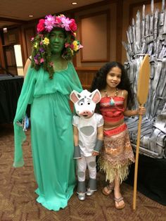 a woman and two children are dressed up as characters from disney's the princess and the frog