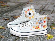 ❤️ Custom Hand-Embroidered Peanuts Converse with Autumn Leaves Step into the world of "Peanuts" with these unique, custom hand-embroidered Converse shoes! Featuring your favorite character from the beloved comic strip, these shoes are a perfect blend of nostalgia and style. Each pair is meticulously crafted with intricate autumn leaf designs, adding a touch of seasonal charm to your wardrobe. 📌 Product Details: Material: High-quality canvas Converse shoes Design: Hand-embroidered Peanuts charac Peanuts Converse, Snoopy Converse, Canvas Converse, Nike Shoes Women Fashion