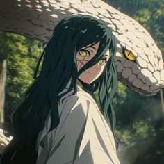 a woman with long hair and yellow eyes holding a snake on her head in front of trees