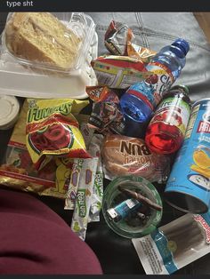 an assortment of snacks and condiments sitting on a table next to each other