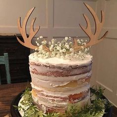 there is a cake with deer antlers on it