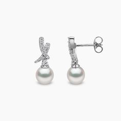 Elevate your style with our Diamond Cross Earrings from the Sleek Collection. Handcrafted in 18K gold, these earrings showcase a contemporary design adorned with brilliant round-cut diamonds and a lustrous white Japanese Akoya pearl. The perfect fusion of elegance and modernity, they offer timeless beauty and sophistication. Pearl Size: 6.5-7mmMetal:18K White GoldApproximate Diamond Weight: 0.25ctLength: 1.8cm Diamond Cross Earrings, Rare Pearls, Mini Cross, Pearl Jewellery, Yoko London, Diamond Cross, Earring Crafts, Pearl Types, Cross Earrings