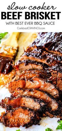 slow cooker beef brisket with bbq sauce on a white plate and garnished with parsley