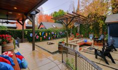 an outdoor patio with lots of furniture and decorations