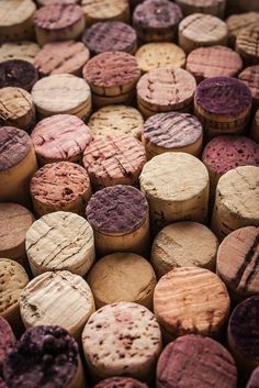 many different types of wine corks stacked on top of each other