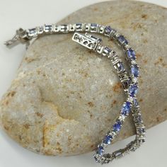 Aaa Tanzanite And Moissanite. Bracelet. (8) In. Platinum Over Sterling Silver Aaa Tanzanite Ovals. (26) Ct.(53) Mm. Moissanite Rounds. (26) Ct.(2) Mm. (8) Ctw.Prong Set. Tab Insert. Aaa Tantalizing Tanzanite Color's. Blue Purplish Blue. Blueberry Violet Blue Adjacent Next To Electrifying Scintillating Glistening Moissanite. Beautiful Gorgeous. New. Gift Box Included. Moissanite Bracelet, Platinum, Violet, Gift Box, Gift Ideas, Women Jewelry, Bracelet, Sterling Silver, Purple