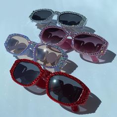 Fashion Bling Sunglasses. Hand Crystaled with High Quality Brilliant Crystals that really shine and sparkle! The same signature crystals I use to crystal luxury bags and shoes! Sunglass details: Adult, Unisex Rectangle Octagon Shape with Gold Medallion on the stem. Quality frames. Substantial thickness. Inspired Italian luxury high fashion sunglasses. Color Options: Silver crystals, Pink crystals, Red crystals, and soft blue (periwinkle) with color shifting AB crystals. The AB is the most limite Rave Sunglasses With Tinted Lenses, Cheap Rave Sunglasses With Mirrored Lenses, Rhinestone Studded Sunglasses, Trendy Luxury Party Sunglasses, Luxury Red Sunglasses For Evening, Luxury Silver Sunglasses For Summer, Luxury Elegant Shield Sunglasses For Party, Elegant Luxury Shield Sunglasses For Parties, Luxury Designer Party Sunglasses