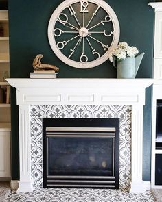 a fireplace with a clock on the wall above it