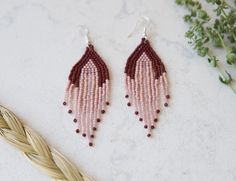 Beaded Fringe Earrings are a classic Indigenous style that is popular amongst the women in my own beading circles. My first pair of beaded earrings was a fringe pair I made over 20 years ago. This pair, in shades of plum, pink, and blush, are 3.5" long. The earrings are hand-beaded in my home in Ontario, Canada using a combination of brick stitch, square stitch and fringe. I used premium glass Toho beads and silver-plated earring hooks with silicone clutches to keep the earrings securely in plac Adjustable Pink Teardrop Beaded Earrings, Elegant Pink Earrings With Tiny Beads, Indigenous Style, Square Stitch, Beaded Fringe Earrings, Toho Beads, Beaded Fringe, Earring Hooks, Brick Stitch