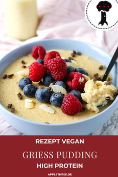 a bowl filled with cereal and berries next to a glass of milk