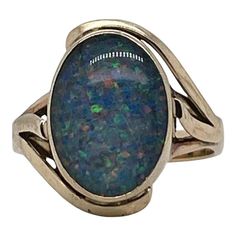 A very fine vintage gold and opal signet style ring.  With oval opal doublet cabochon bezel set in 9ct gold.   Simply a great ring!  Date: 20th Century  Overall Condition: It is in overall good, as-pictured, used estate condition with some very fine & light surface scratches and other signs of expected light wear consistent with age.  Fineness: Marked 9ct for gold fineness.    Marks: 9ct  Measurements: Height: ca. 23 mm Length: ca. 17 mm Width: ca. 19 mm  Weight: ca. 3.5 grams  Ring Size: 6.75 Signet Ring, Cocktail Rings, Bezel Setting, Vintage Gold, 20th Century, Jewelry Rings, Opal, Ring Size, Size 6