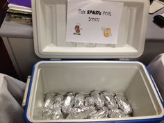 there are many tin foil wrapped cookies in the coolers on this plane, and one has a sign that says the spuds for yogurt