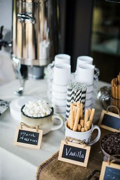 a table topped with plates and cups filled with food