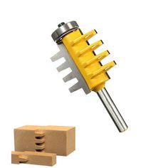 a wooden block with a yellow and silver tool next to it's attachments