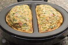 two omelets sitting on top of a black pan