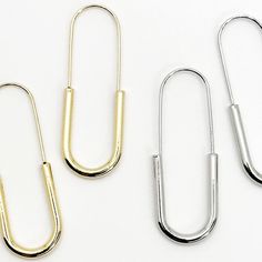 Lightweight and easy to accessorize, these modern and elegant safety pins earrings are crafted in Sterling Silver plated 14k Gold. Metal: Silver 925, 14k Yellow Gold PlatedDimensions: approx. 1/8" depth x 1/2" width x 1.5" heightHypoallergenic and antimicrobialNickel-free and lead-free Pins Earrings, Large Safety Pin, Modern Punk, Pin Earrings, Safety Pin Earrings, Safety Pins, Punk Jewelry, Safety Pin, Silver 925