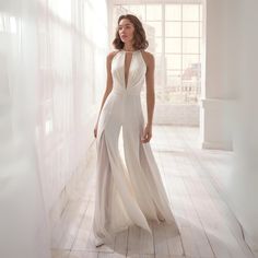 Jumpsuit Wedding Dress Couture Candy, Wedding Dress/jumpsuit, Luxury White Evening Jumpsuits And Rompers, White Jumpsuit With Skirt Overlay, Jumpsuit Wedding Dress Big Bow, Jumpsuit Wedding Dress Elegant, Luxury Summer Wedding Jumpsuits And Rompers, Luxury Elegant Jumpsuits And Rompers For Wedding, Wedding Jumpsuit The Bride Azazie