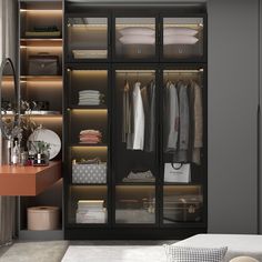 an open closet with clothes and other items in it