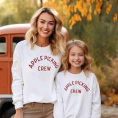 Apple Picking Crew graphic in cream on front of sweatshirt to t-shirt. Perfect for all your Fall activities (apple picking, pumpkin patches, Thanksgiving etc.) to show off your love for Fall/Autumn spirit! Personalization: 1. Type the color of graphic that you would like. Choice of Cream or Brick Red ONLY. Adult Sizes S-XXL (unisex sizing) Youth Sizes S-XL (unisex sizing) Sweatshirt colors vary. Toddler Sizes 2T, 3T, 4T (T-shirt only) Gildan 18000 Heavy Blend, Port & Co, Jerzzees (availability varies) 50/50 cotton/polyester Classic, unisex fit 1x1 rib with spandex Bella + Canvas (Adult, Youth & Toddler Tees) 4.2 oz. Airlume combed and ring-spun cotton Pre-shrunk For a more relaxed fit, size up! Shipping || All orders over $35 ship for free! We will combine shipping and refund for any shipp White Family Matching Sweatshirt For Fall, Fall Family Matching Crew Neck Tops, Family Matching Cotton Sweatshirt For Fall, Autumn Spirit, Camp Brand, Sweatshirt Colors, Pumpkin Patches, Camp Style, Fall Activities