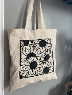 These beautiful canvas totes come in one size- 15" x 16". Perfect for your everyday bag, grocery shopping, school, etc! The material is recycled cotton so it's 100% eco friendly & reusable! The 27" long handles provide a comfortable carry & makes them durable to heavy weights! I make to order, so because of this, shipping time varies. Processing and creating your item may take 1-2 days, so your item will be shipped out 3-4 days from purchase! **IF A WASH IS NEEDED** - Machine wash on cold or warm water inside out - Tumble dry on low heat OR air dry If there's any ever questions or concerns, feel free to contact me directly on Etsy ORRRR dm me on instagram https://www.instagram.com/shemadevinyls/ White Rectangular Canvas Bag With Eco-friendly Ink, Rectangular White Canvas Bag With Eco-friendly Ink, Eco-friendly White Rectangular Canvas Bag, Eco-friendly Square Canvas Bag, Reusable Grocery Tote Canvas Bag, Reusable Tote Canvas Bag For Groceries, White Eco-friendly Canvas Bag For Grocery Shopping, Eco-friendly White Canvas Grocery Bag, White Rectangular Reusable Canvas Bag