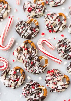 chocolate covered pretzels with candy canes and sprinkles on top