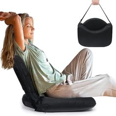 a woman sitting in a chair with her hand on the shoulder and an object hanging from it's back