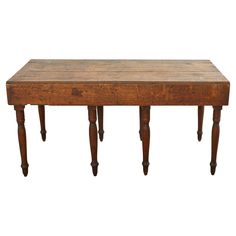 an old wooden table with three legs