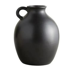 a black vase is shown on a white background